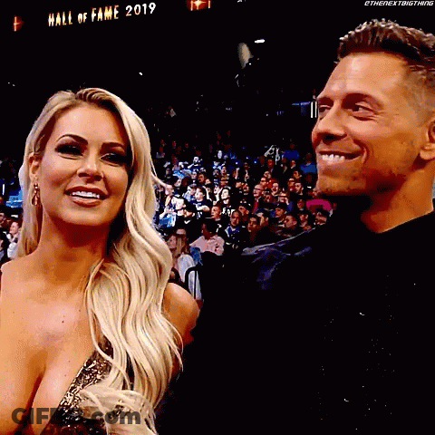 Man And Woman Smiling In Crowd GIF