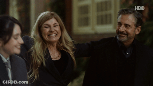Man And Woman Smiling In Front Of HBO Building GIF