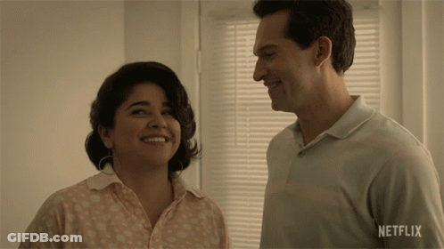 Man And Woman Smiling In Front Of Netflix Window GIF