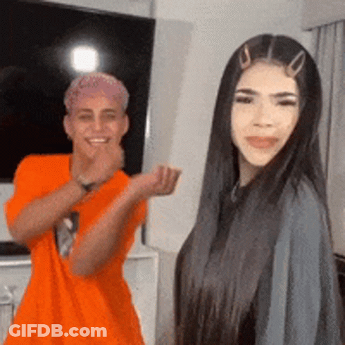 Man And Woman Smiling In Living Room GIF