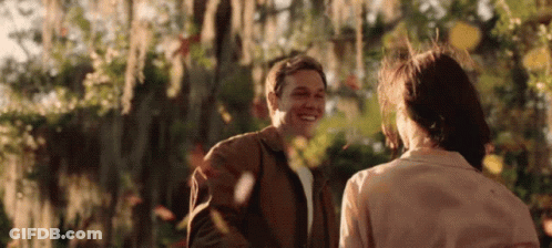 Man And Woman Smiling In Park GIF