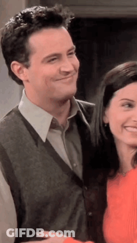 Man And Woman Smiling Next To Each Other GIF