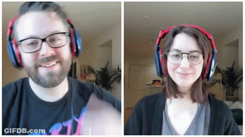 Man And Woman Smiling With Headphones GIF