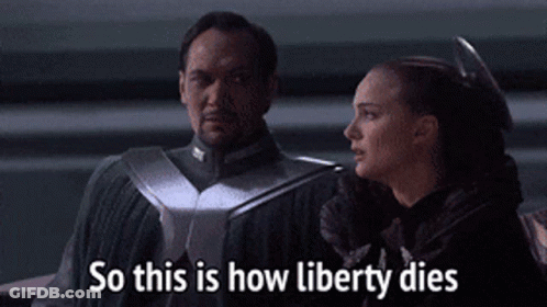 Man And Woman So This Is How Liberty Dies GIF