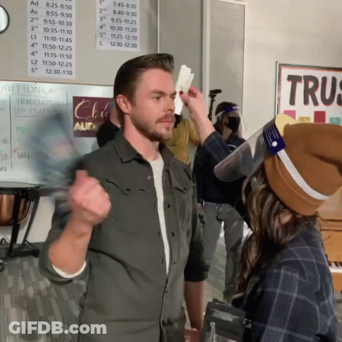 Man And Woman Standing Before Trus Sign GIF