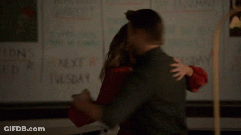 Man And Woman Standing Before Trust Sign GIF