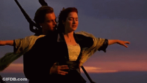 Man And Woman Standing Beside Sunset GIF