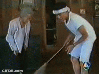 Man And Woman Standing Beside Sweeping Man GIF