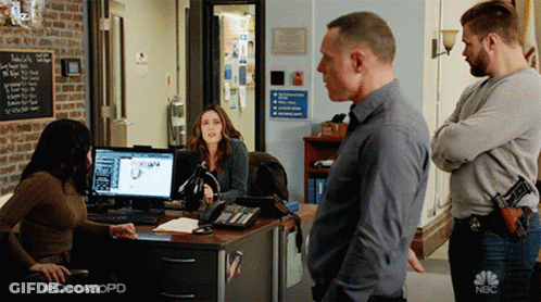 Man And Woman Standing By Door GIF