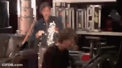 Man And Woman Standing By Drums GIF