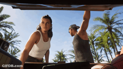 Man And Woman Standing In Back Of Car GIF
