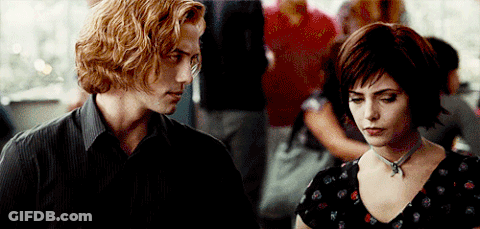 Man And Woman Standing In Crowded Area GIF