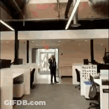 Man And Woman Standing In Cubicle GIF