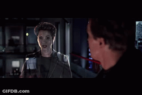 Man And Woman Standing In Dark Room GIF
