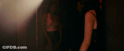 Man And Woman Standing In Dark Room GIF