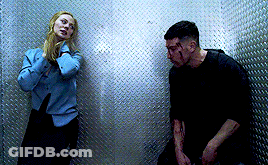 Man And Woman Standing In Dark Room GIF