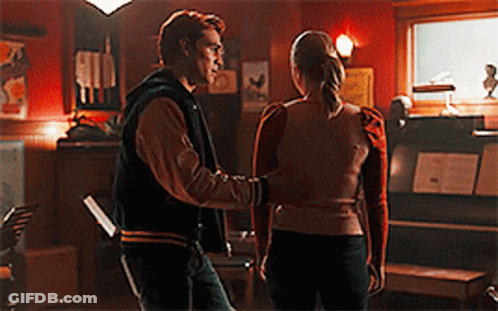 Man And Woman Standing In Dark Room GIF