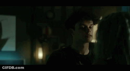 Man And Woman Standing In Dark Room GIF