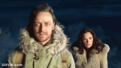 Man And Woman Standing In Dark Room GIF