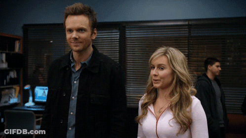 Man And Woman Standing In Dark Room GIF