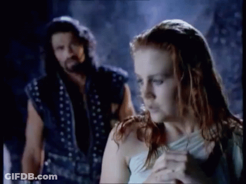 Man And Woman Standing In Dark Room GIF