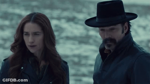Man And Woman Standing In Dark GIF