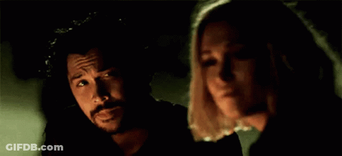 Man And Woman Standing In Darkness GIF