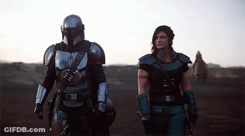 Man And Woman Standing In Desert GIF