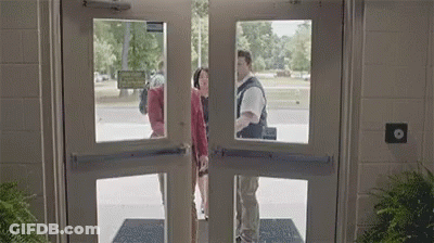 Man And Woman Standing In Doorway GIF