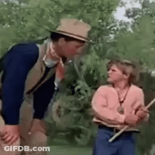 Man And Woman Standing In Field GIF