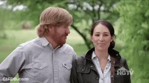 Man And Woman Standing In Field GIF