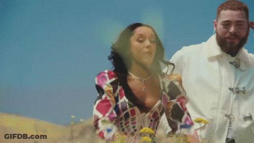 Man And Woman Standing In Field GIF