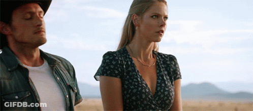 Man And Woman Standing In Field GIF