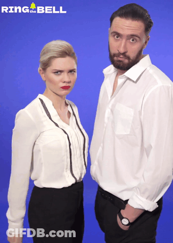 Man And Woman Standing In Front Of Blue Background Saying Ring The Bell GIF