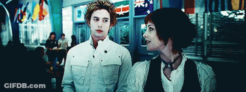 Man And Woman Standing In Front Of Building GIF