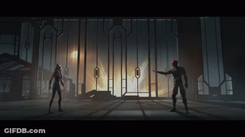Man And Woman Standing In Front Of Building GIF