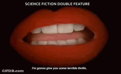 Man And Woman Standing In Front Of Candles GIF