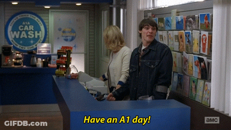 Man And Woman Standing In Front Of Car Wash GIF