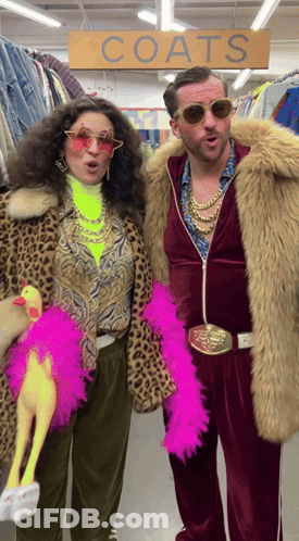 Man And Woman Standing In Front Of Coats Sign GIF