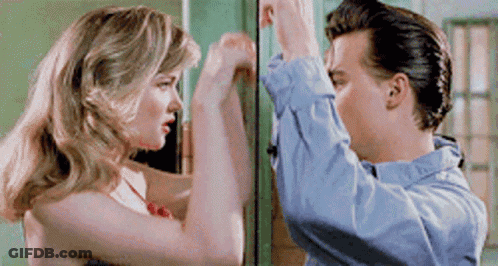 Man And Woman Standing In Front Of Door GIF