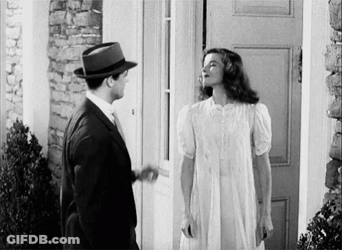 Man And Woman Standing In Front Of Door GIF