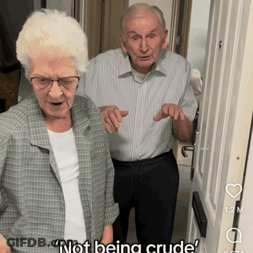 Man And Woman Standing In Front Of Door Not Being Crude GIF