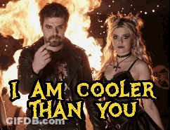 Man And Woman Standing In Front Of Fire I Am Cooler Than You GIF