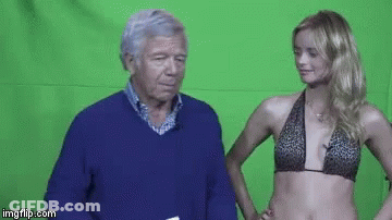 Man And Woman Standing In Front Of Green Screen GIF