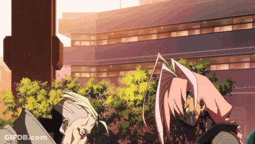 Man And Woman Standing In Front Of Large Building GIF