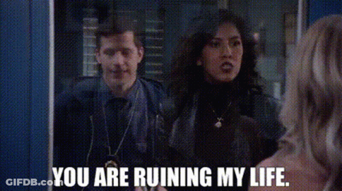Man And Woman Standing In Front Of Mirror GIF