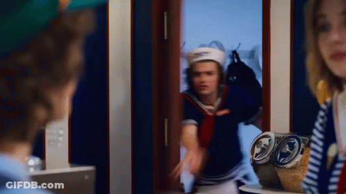 Man And Woman Standing In Front Of Mirror GIF