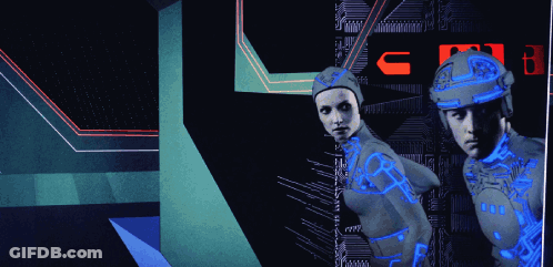 Man And Woman Standing In Front Of Sign Saying C GIF