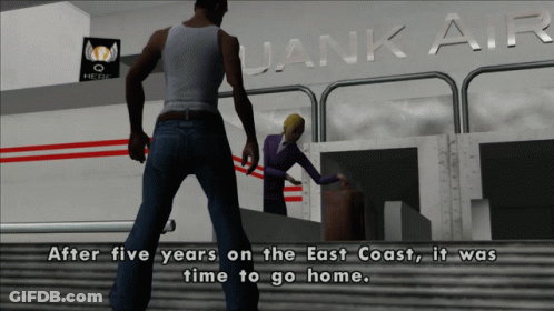 Man And Woman Standing In Front Of Uanik Air Sign GIF