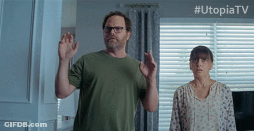 Man And Woman Standing In Front Of Window With Utopiatv GIF